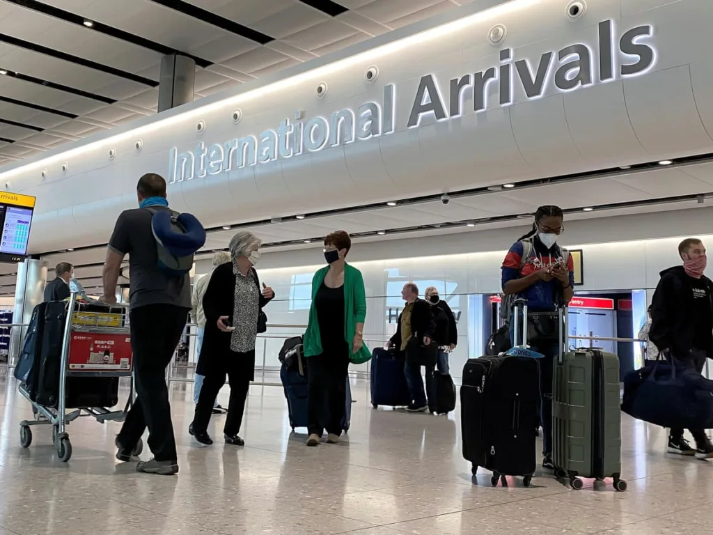 International travelers arriving at the airport with their luggage