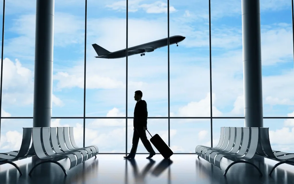 International traveler walking through an airport terminal