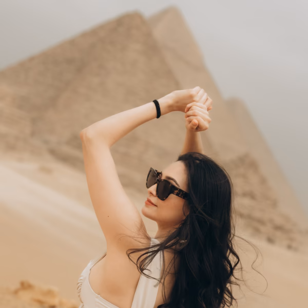 Traveler posing near Giza Pyramids during Cairo tour from El Gouna with Book Egypt Travel