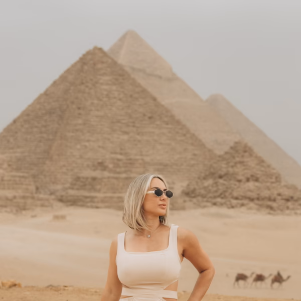 Traveler posing at Giza Pyramids during Cairo tour from El Gouna with Book Egypt Travel