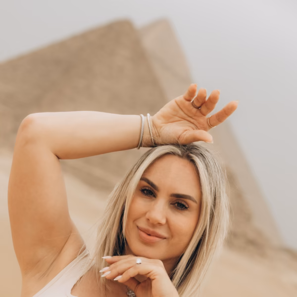 Tourist posing near Giza pyramids Egypt desert experience on 4 Days Christmas Tour Through Cairo Sightseeing Cairo Egypt
