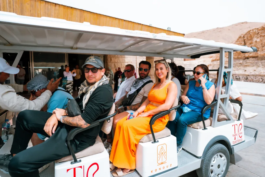Tourists riding an electric shuttle at the Valley of the Kings in Luxor