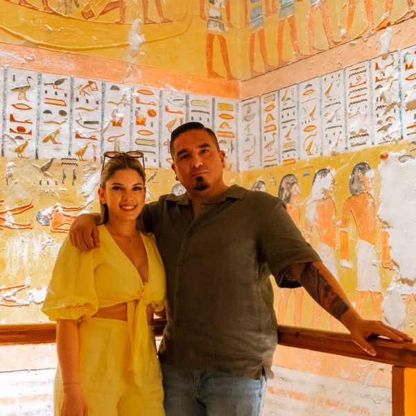 Couple inside decorated tomb in Valley of the Kings Luxor during 3 Days Trip to Cairo Luxor & Aswan from El Gouna