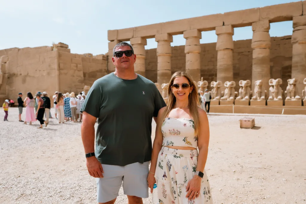 Couple visiting the Avenue of Sphinxes at Karnak Temple