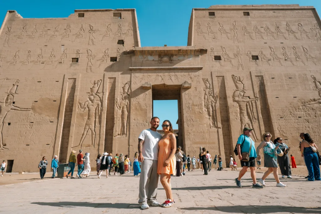 Couple visiting the magnificent Edfu Temple in Upper Egypt