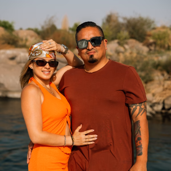 Couple enjoying Nile River cruise in Aswan Egypt during sunset