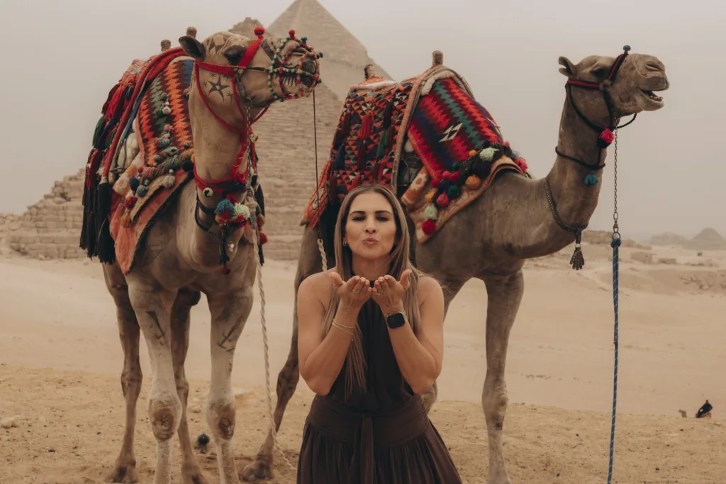 our guest with decorated camels at the Giza Pyramids