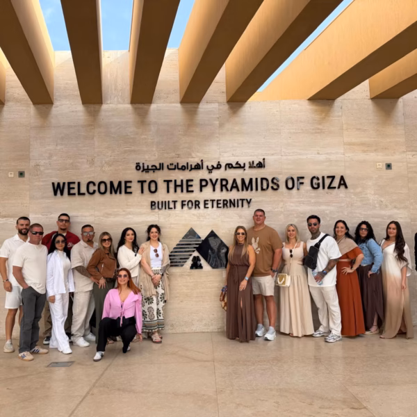 tour group Giza pyramids Egypt welcome sign travel experience Cairo Egypt
