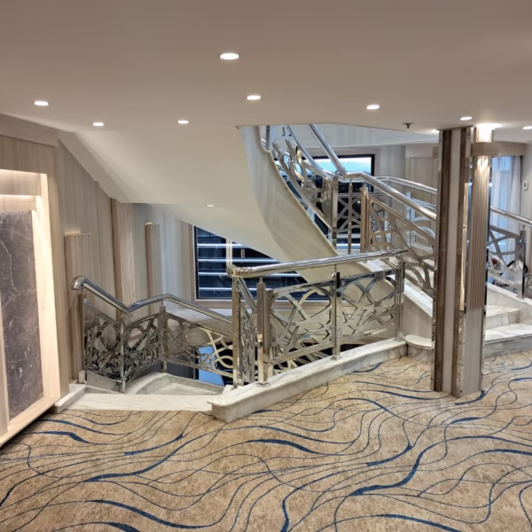 Modern Nile cruise staircase with marble steps and ornate silver railings for a luxury Egypt river tour.