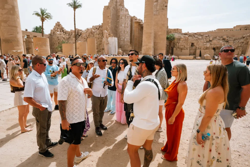 Visitors exploring Karnak Temple with an Egyptologist guide